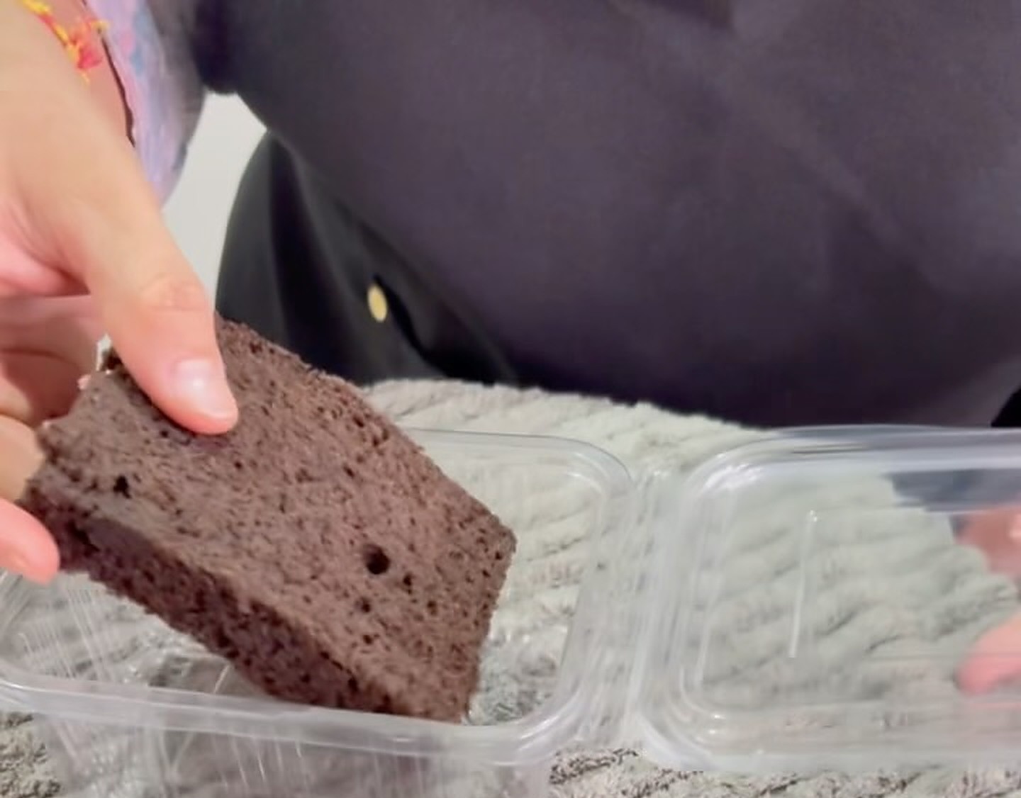 Slice of London chocolate cake with soft chocolate sponge